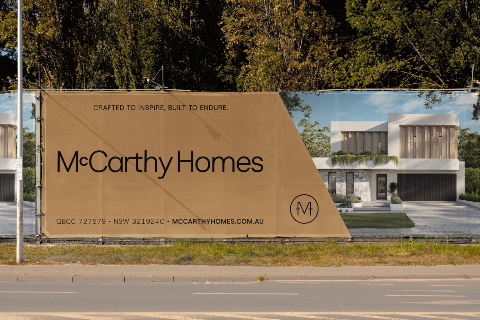 McCarthy Homes billboard displaying "Crafted to Inspire, Built to Endure" tagline with modern house imagery and contact details.