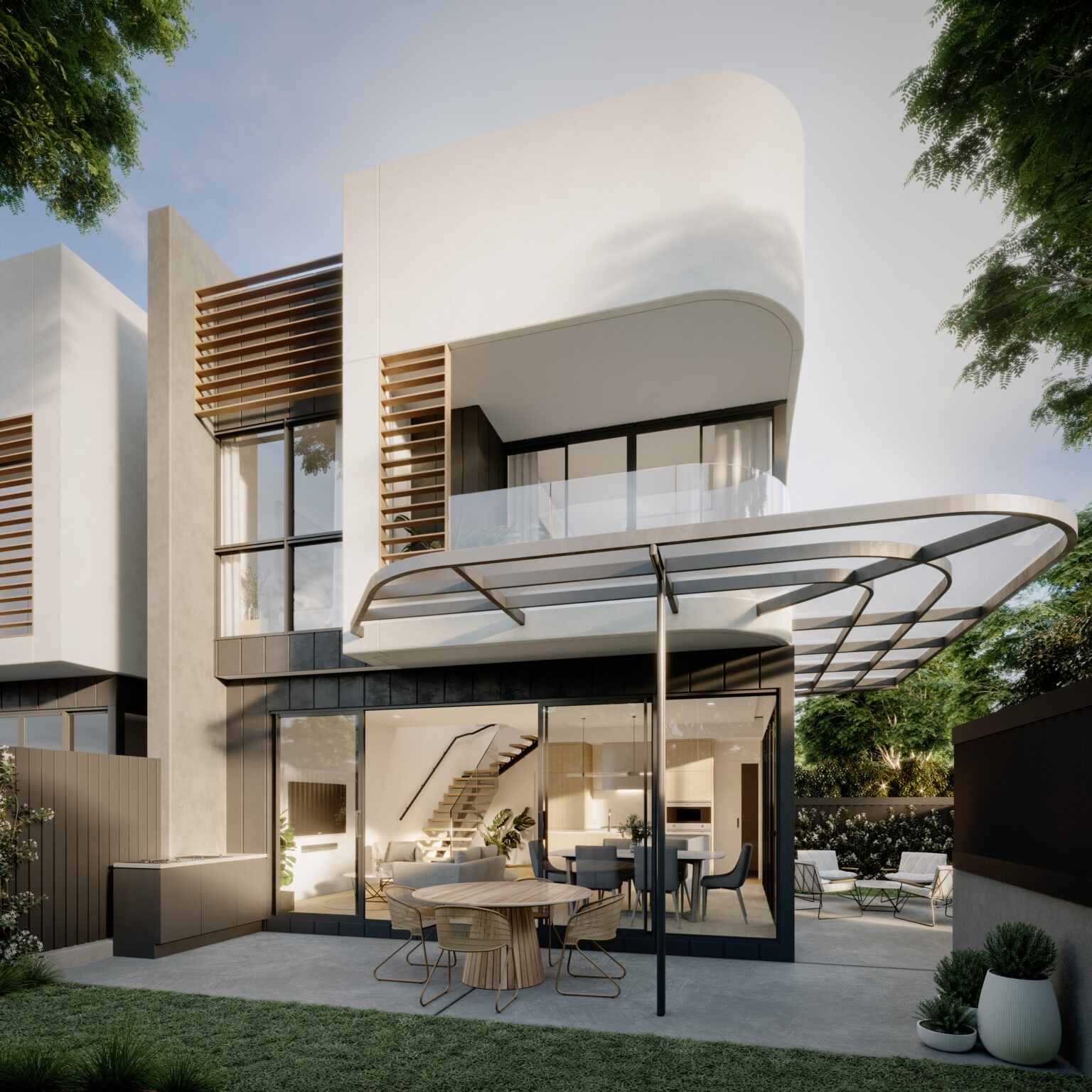 Modern white residential building with curved architecture, wooden slat details, glass facades, outdoor dining area, and landscaping.